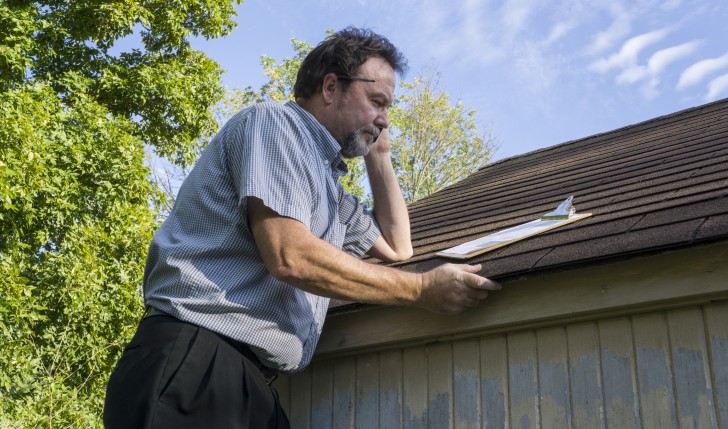 Insurance Adjuster doing roof inspection - Stadry Roofing & Restoration